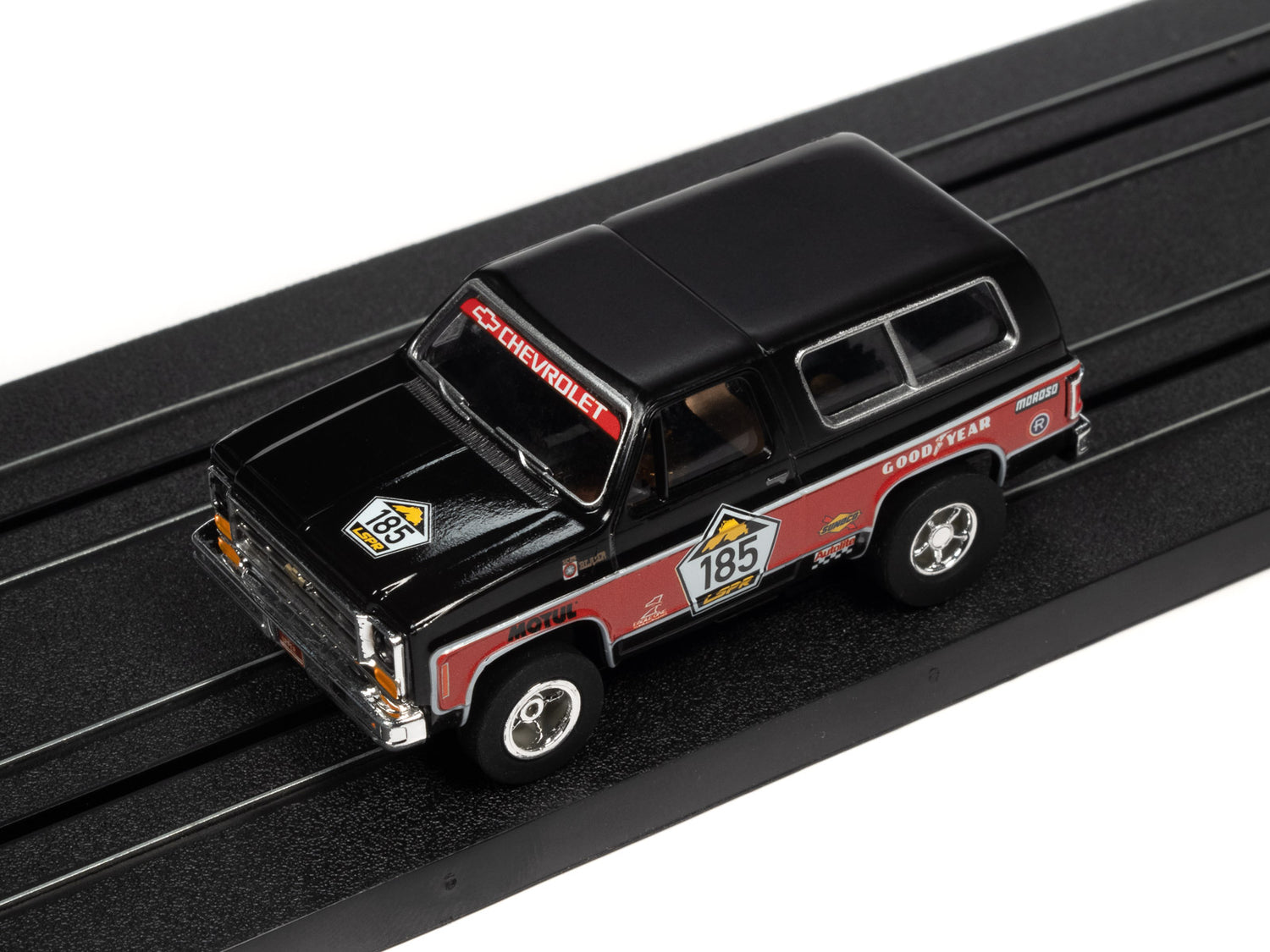 Auto World Xtraction 1977 Chevrolet Blazer (Black, Red) HO Slot Car - Auto World Store