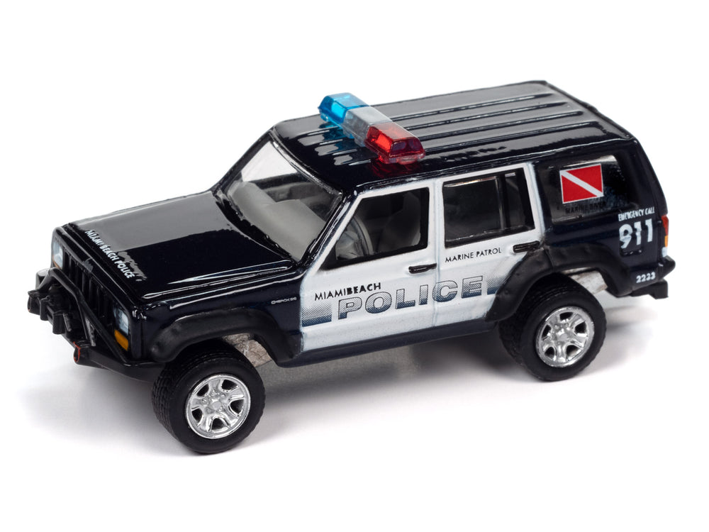 Johnny Lightning 1988 Jeep Cherokee (Dark Montego Blue) w/Mastercraft Boat & Light Bar 1:64 Diecast