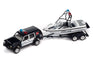 Johnny Lightning 1988 Jeep Cherokee (Dark Montego Blue) w/Mastercraft Boat & Light Bar 1:64 Diecast