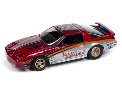 "PRE-ORDER" Johnny Lightning Muscle Cars 1987 Pontiac Trans Am King of the Jungle (Metallic Red w/Silver & Gold + King of the Jungle Race Graphics) 1:64 Scale Diecast (DUE NOVEMBER 2025)
