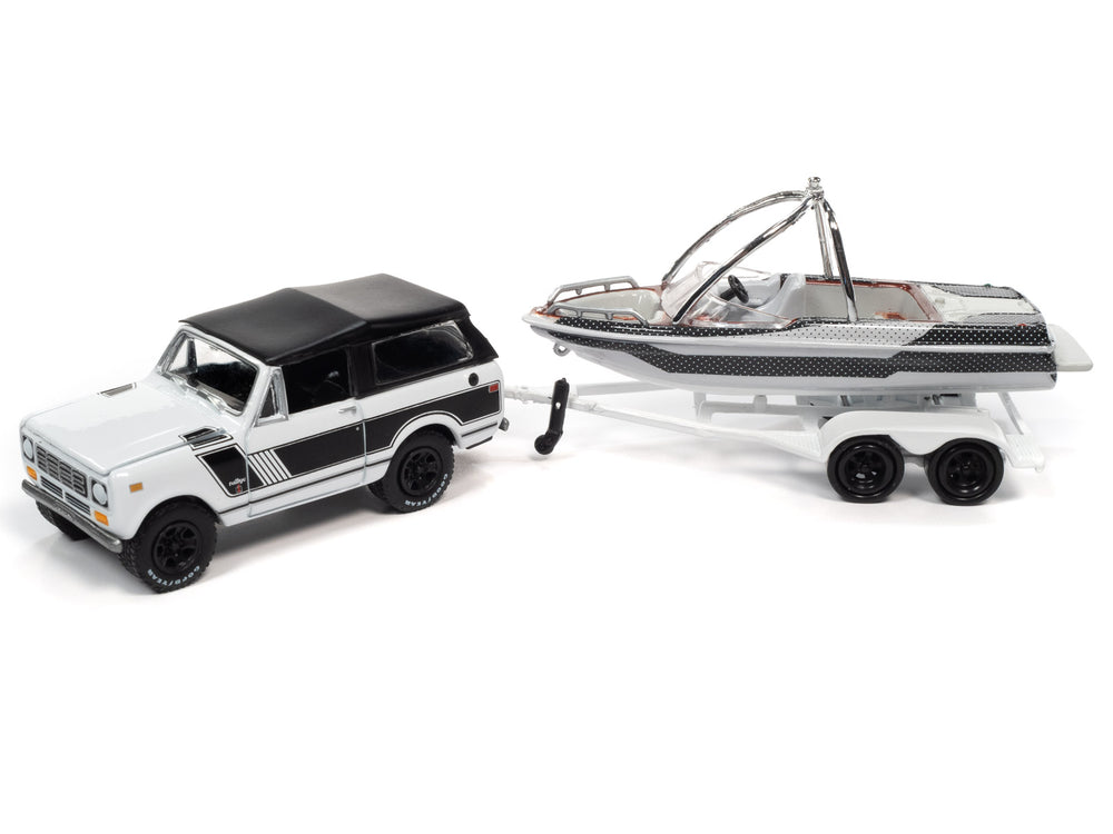 Johnny Lightning 1979 International Scout II (White w/Black Stripes, White & Black) w/Malibu Boat and Trailer 1:64 Diecast