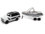Johnny Lightning 1979 International Scout II (White w/Black Stripes, White & Black) w/Malibu Boat and Trailer 1:64 Diecast
